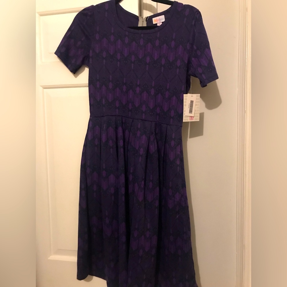 This is the Amelia, a Rare dress! Beautiful purple print.